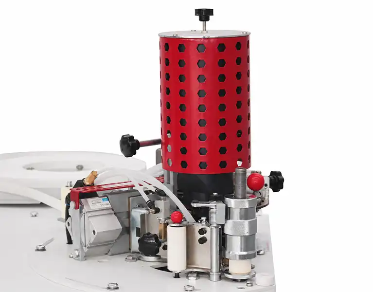 Detailed view of the HE-370 upper glue pot design, engineered for quick switching between EVA and PUR adhesives with zero leakage.