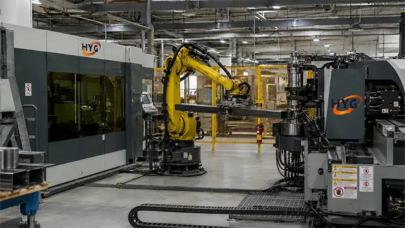 Heavy-duty HYG TECH tube and pipe processing line integrating high-speed fiber laser tube cutters with multi-axis CNC automatic tube bending machines.