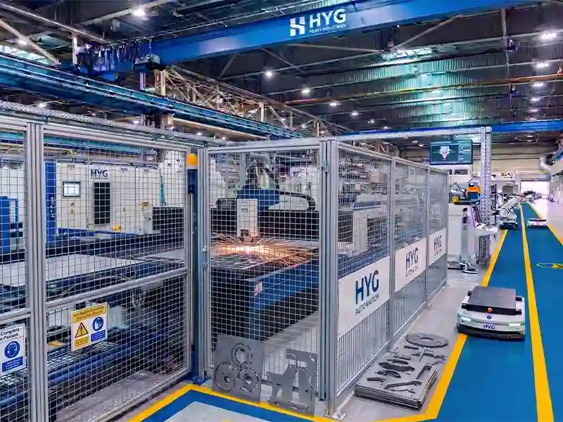 HYG TECH multi-station automated sheet metal processing line integrating a coordinated AGV fleet for autonomous pallet transport and material routing.