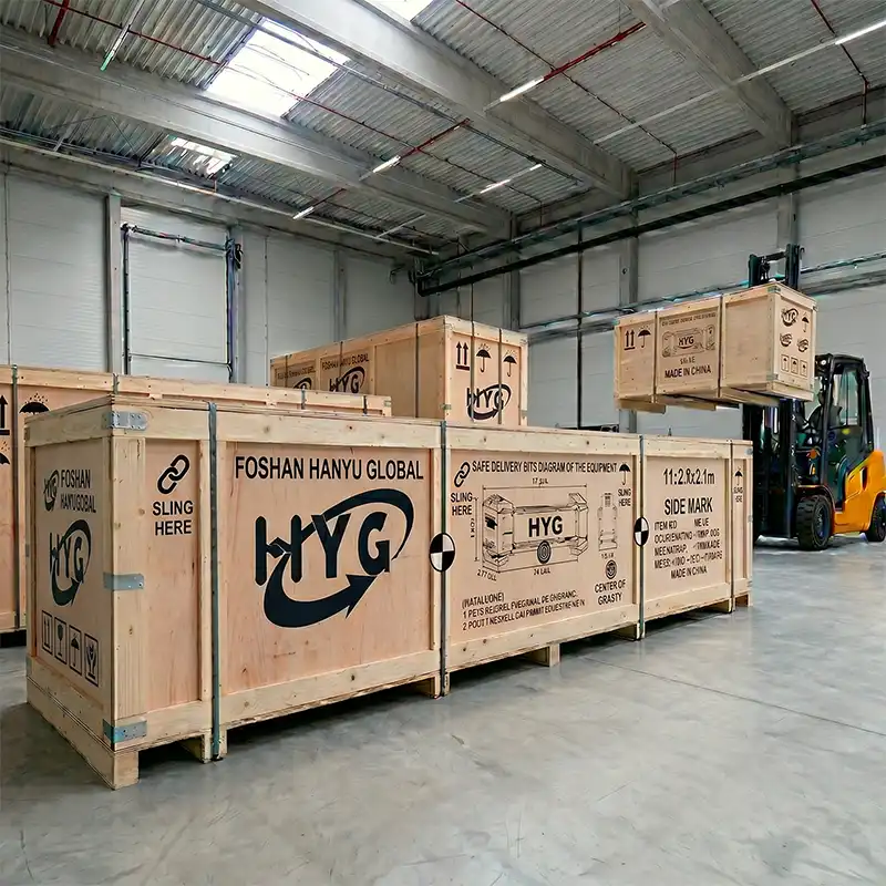HYG Machinery global export logistics team executing heavy-duty steel lashing and vacuum-sealed container loading for cross-border CNC equipment shipping.